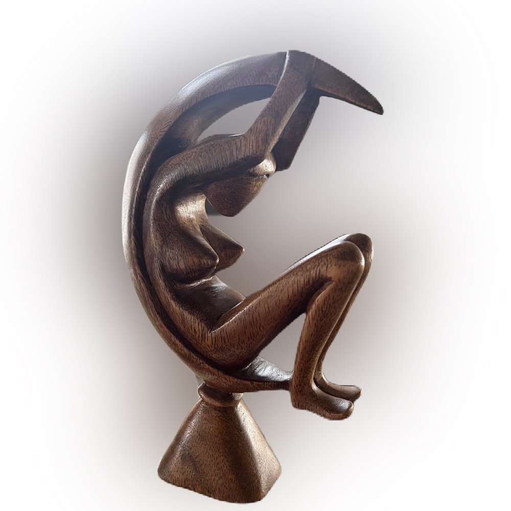Women and moon wood carving